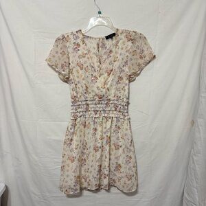 Trixxi brand floral print flutter sleeve smocked waist mini dress.